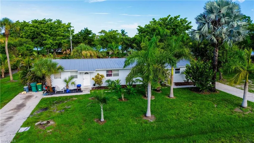Single story home featuring a front yard