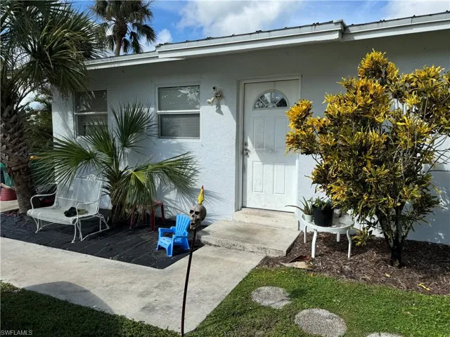 Property entrance featuring a patio area