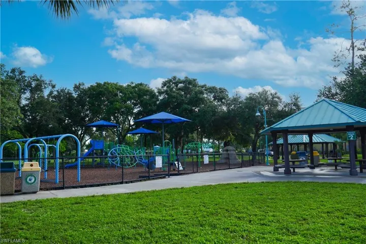 View of jungle gym featuring a gazebo and a lawn