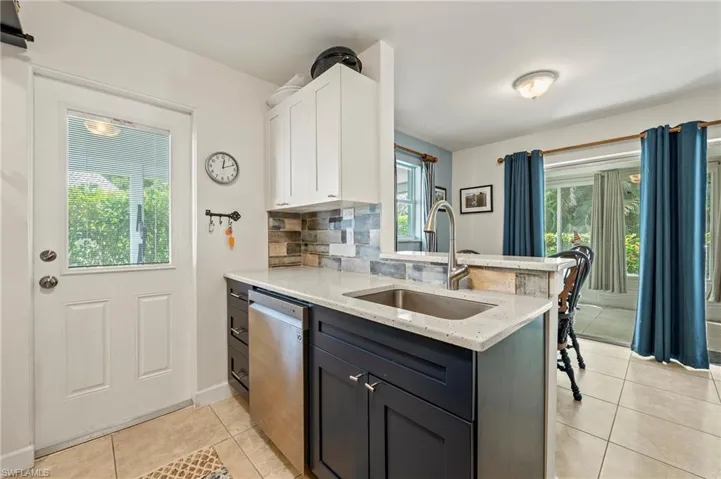 The kitchen is right next to the dining area.