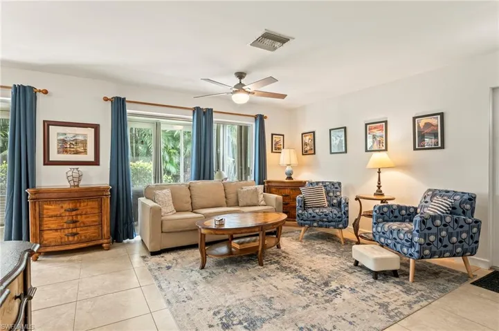 Large tile, neutral decor and access to the enclosed, air conditioned lanai and front door.