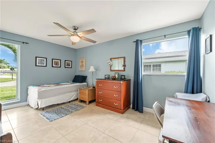 The spare bedroom is quite spacious as well, and features tile floors and remote controlled fan.
