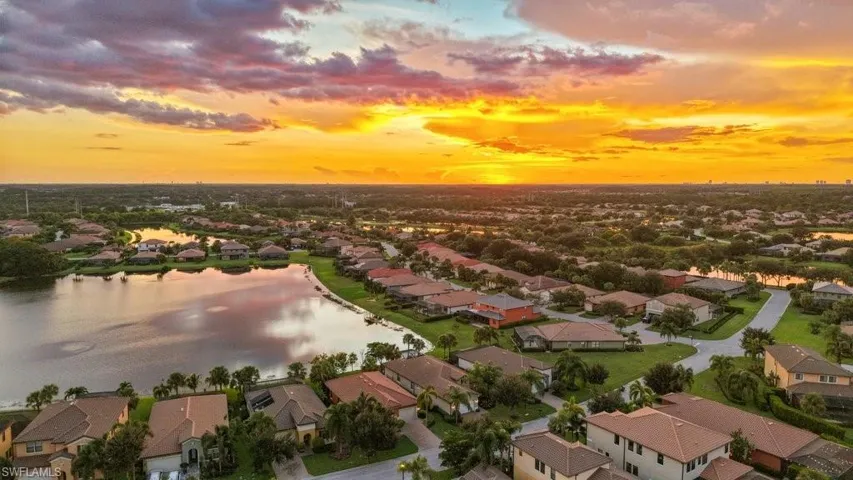 Neighborhood featuring single-family homes, multiple interconnected lakes, and abundant mature trees