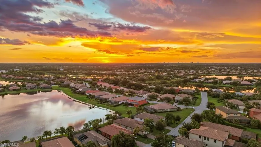 Expansive residential community featuring water frontage, mature landscaping, and diverse architectural styles