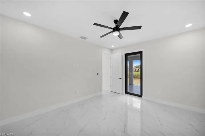 Empty room featuring ceiling fan