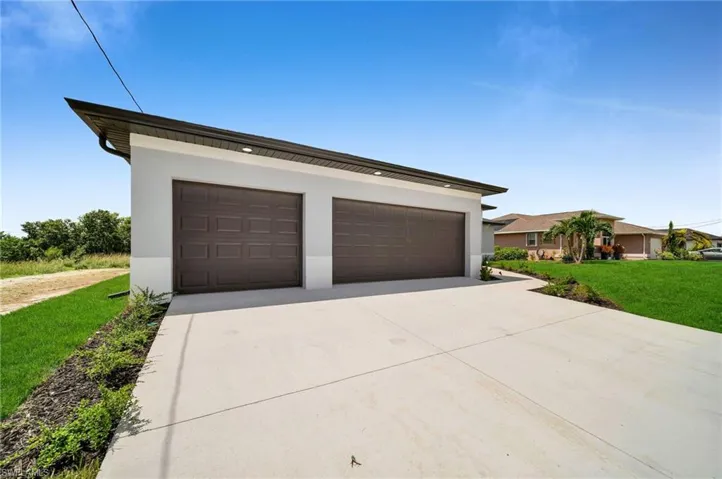 Garage with a lawn