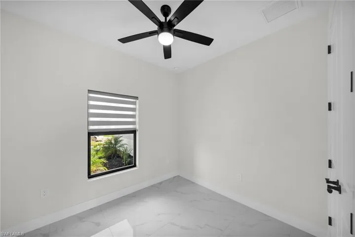 Spare room featuring ceiling fan