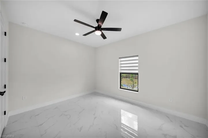 Empty room featuring ceiling fan