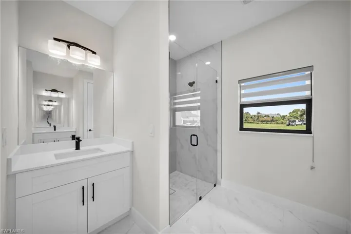 Bathroom with vanity and an enclosed shower