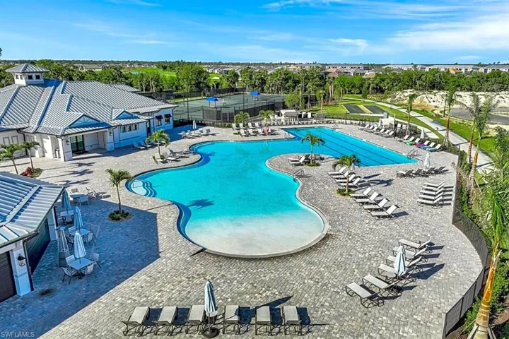 Community pool featuring a patio