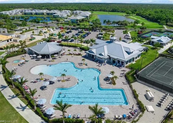 Drone / aerial view of a large body of water and a pool area