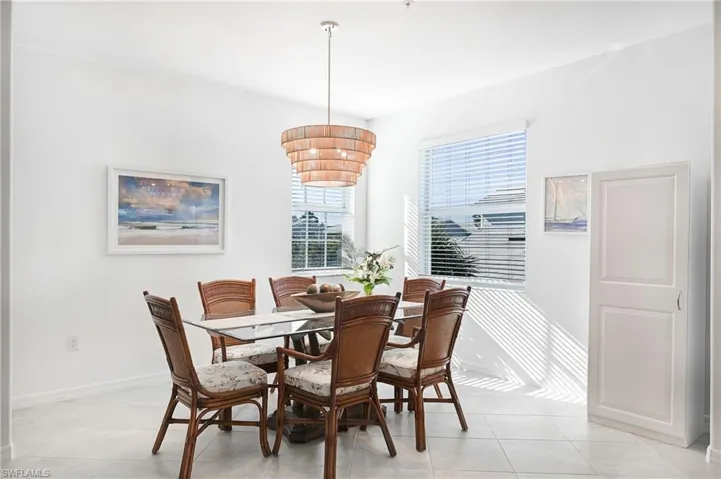 Dining room featuring baseboards and light tile patterned flooring