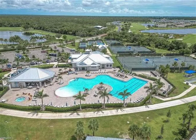 Aerial view of a nearby body of water and a pool