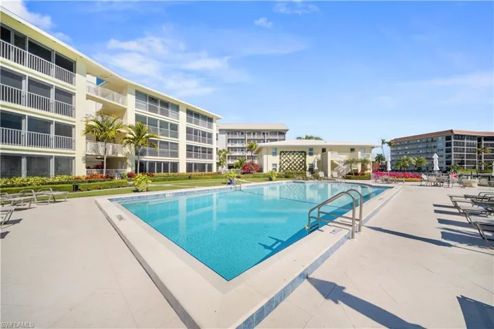 Community pool featuring a patio