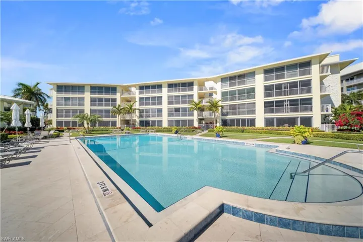 Community pool with a patio area