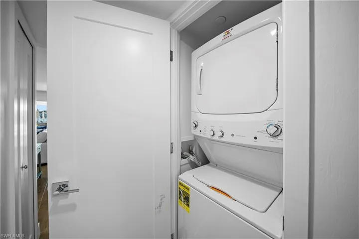 Laundry area with stacked washer / drying machine