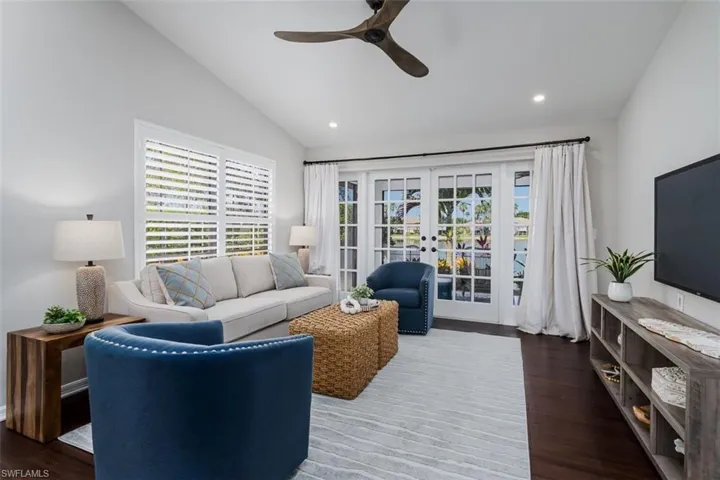 French Doors with beautiful drapes. CUSTOM FAN!