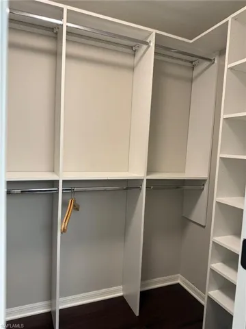 Primary Walk in Closet with built in system