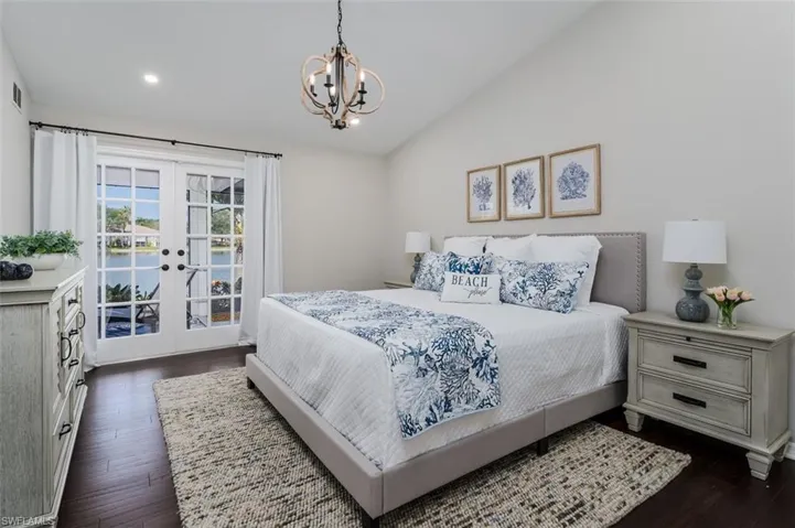 Primary Bedroom with soaring Vaulted Ceiling!