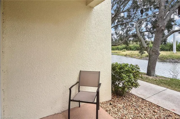 View of patio with a water view