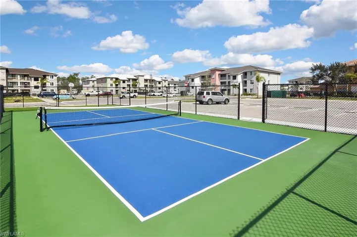 View of tennis court with basketball court