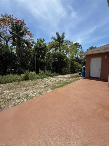 Expansive exterior patio space featuring a textured surface