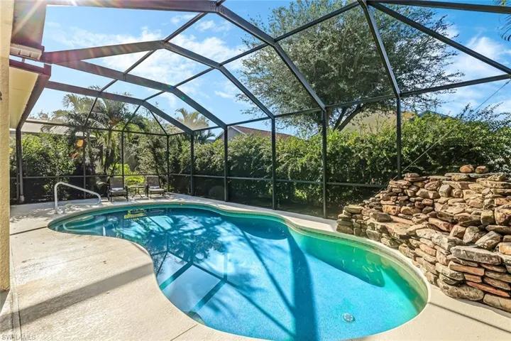 View of pool featuring a lanai and a patio area