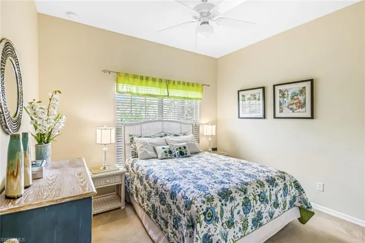 Bedroom featuring ceiling fan and carpet flooring