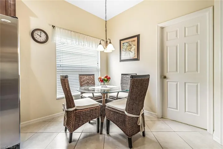 Dining room featuring an inviting chandelier and light tile patterned floors