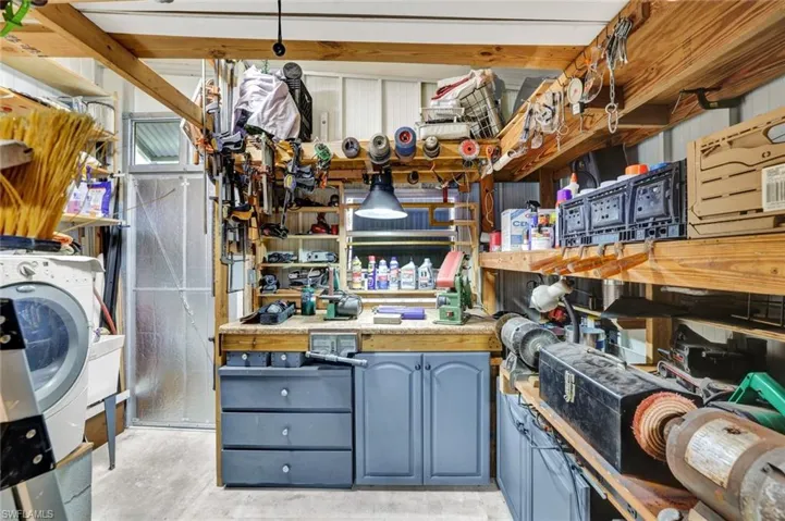 Storage room featuring washer / dryer