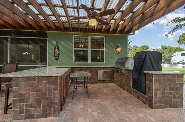 Outdoor kitchen with gas for turkey fryer, grill and smoker. Smoker is excluded from sale