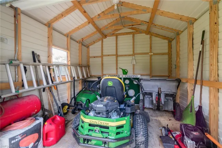 View of storage  building.. lawn equipment negotiable.
