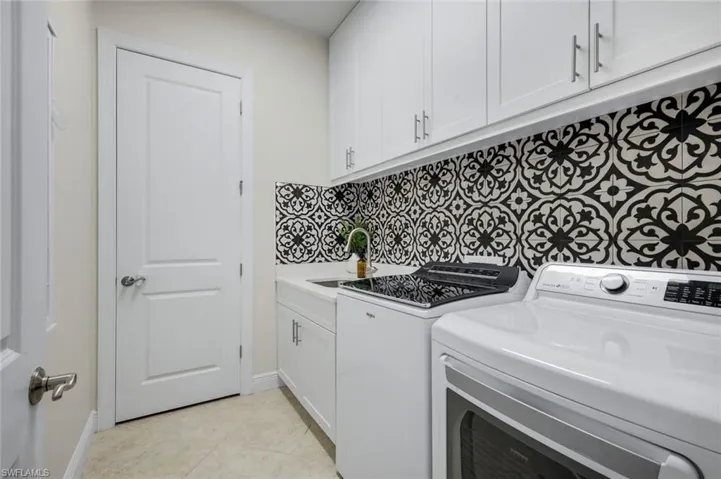 Laundry Room with Cabinetry & Sink