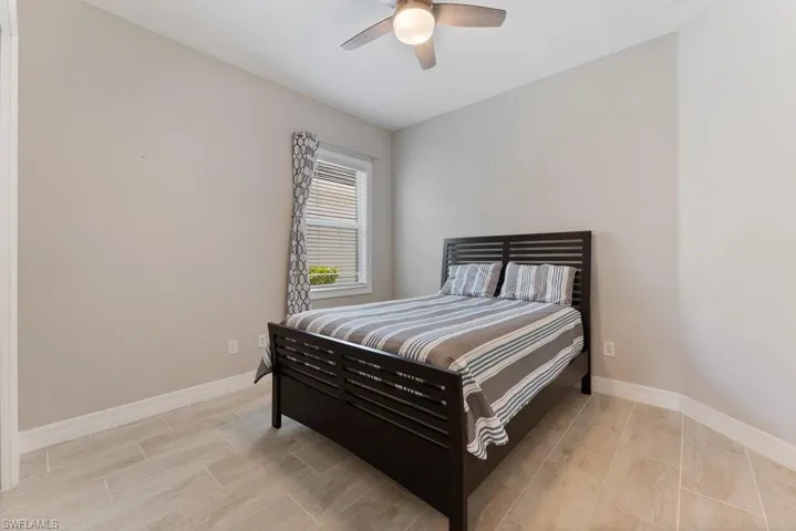 Bedroom featuring baseboards and a ceiling fan