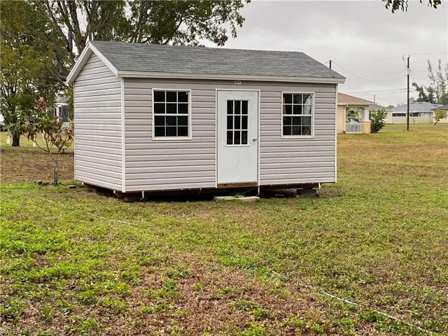 View of outdoor structure featuring an outbuilding