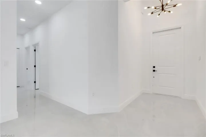 Foyer with inviting chandelier