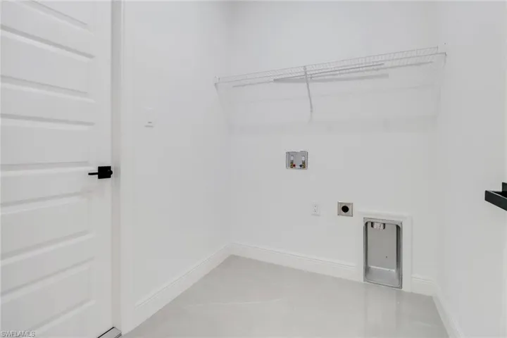 Laundry room featuring hookup for a washing machine, and electric dryer hookup