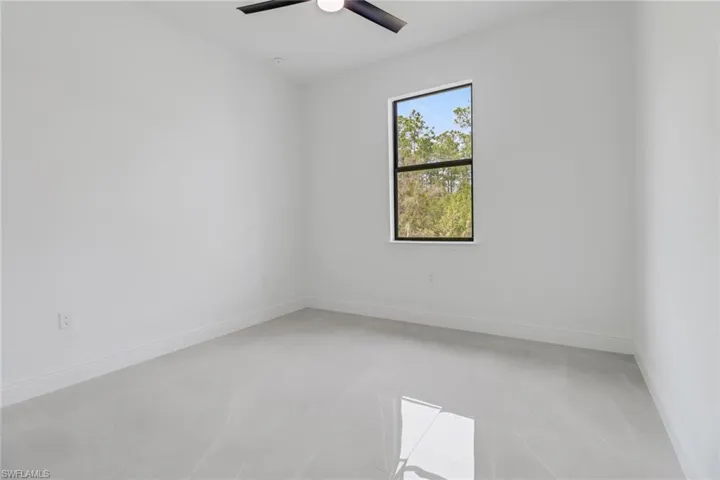 Guest bedroom featuring ceiling fan