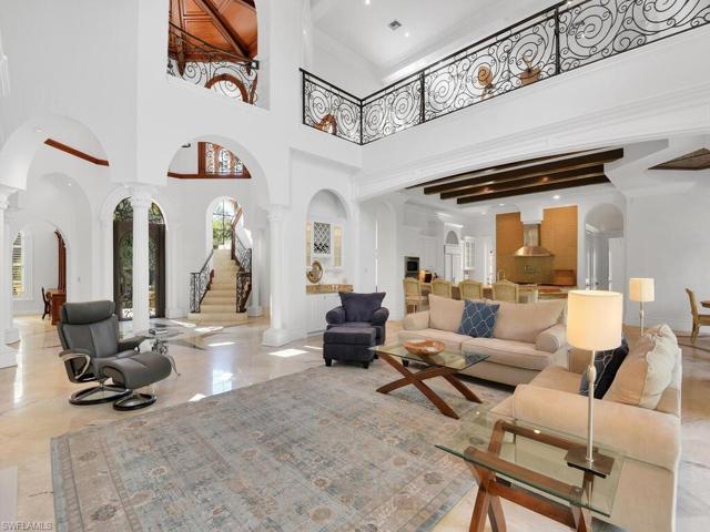 with view of the kitchen, balcony and stairway to the second floor