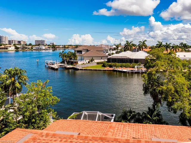 Property view of water featuring a boat dock