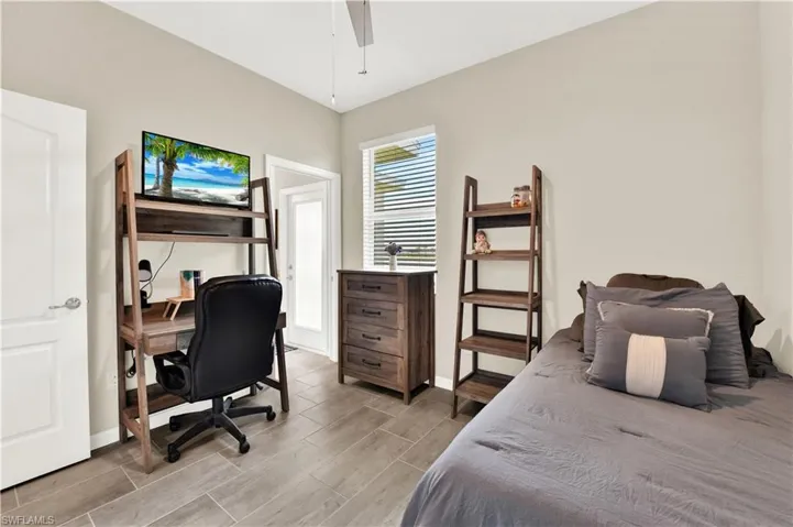 Bedroom featuring light hardwood / wood-style floors and ceiling fan