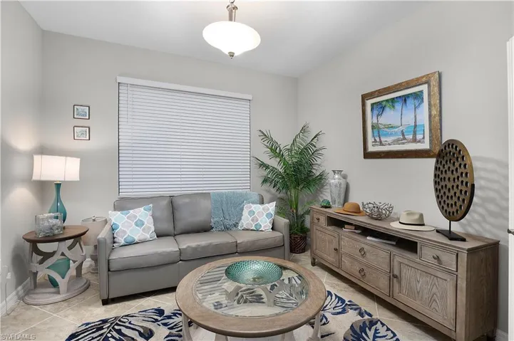 Living room featuring light tile patterned floors