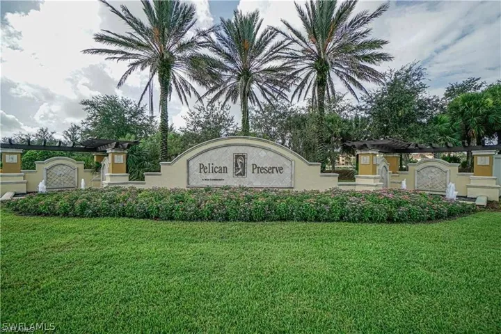 Community sign featuring a lawn