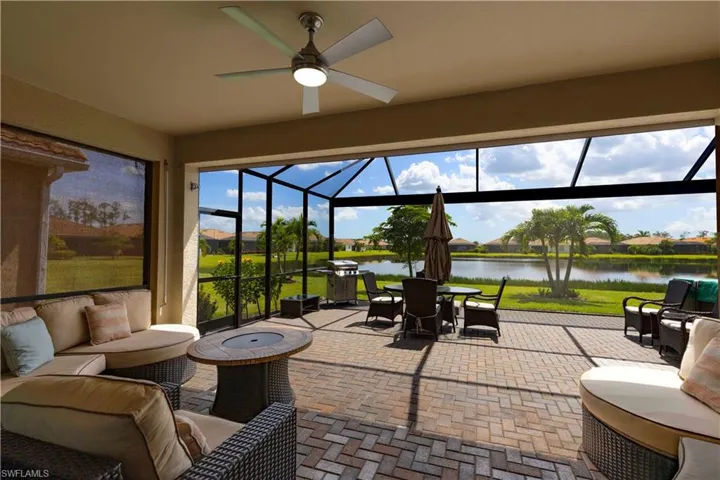 Sunroom featuring a water view, ceiling fan, and plenty of natural light