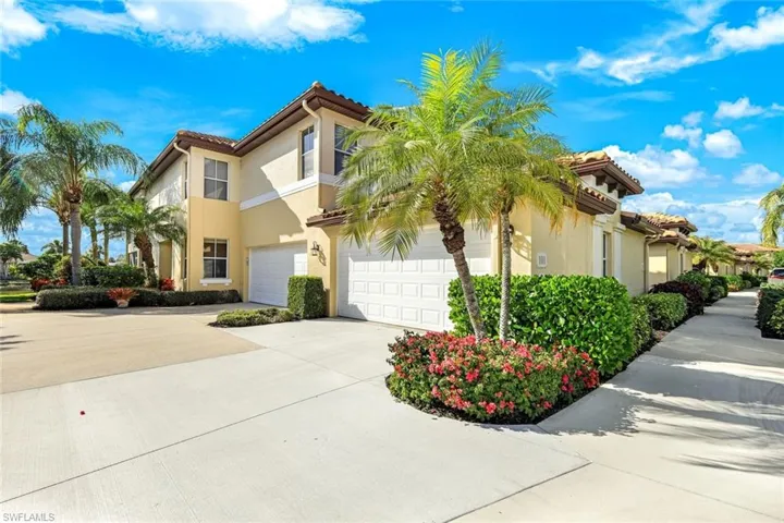 Mediterranean / spanish home with concrete driveway, stucco siding, and a tiled roof