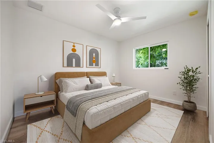 Bedroom featuring wood finished floors and a ceiling fan