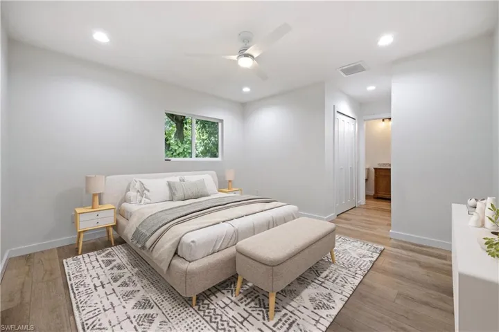 Bedroom featuring recessed lighting, light wood-style floors, a closet, and a ceiling fan