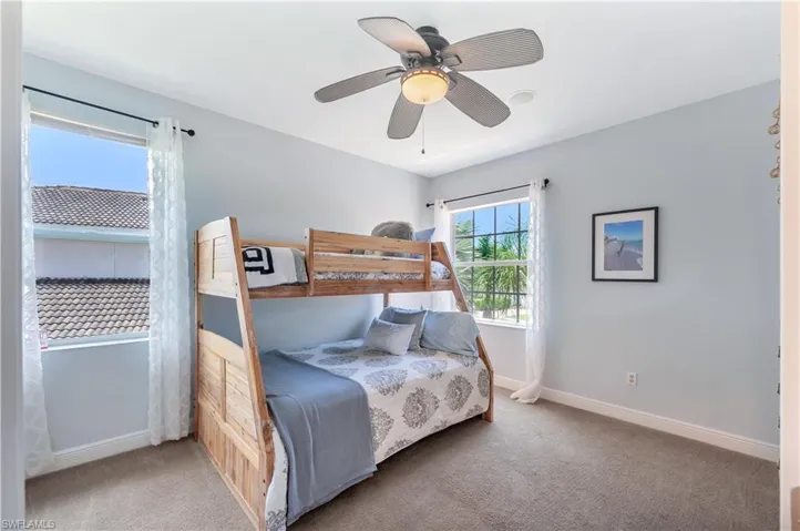 Bedroom with carpet and ceiling fan