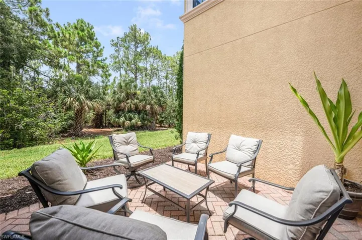 View of patio with view of wooded area