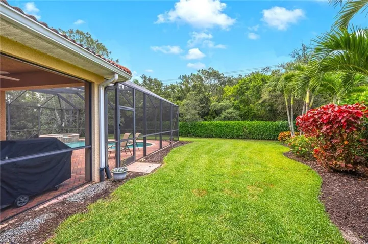 View of grassy yard with a patio